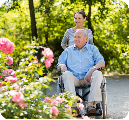 A caregiver and a resident in a garden